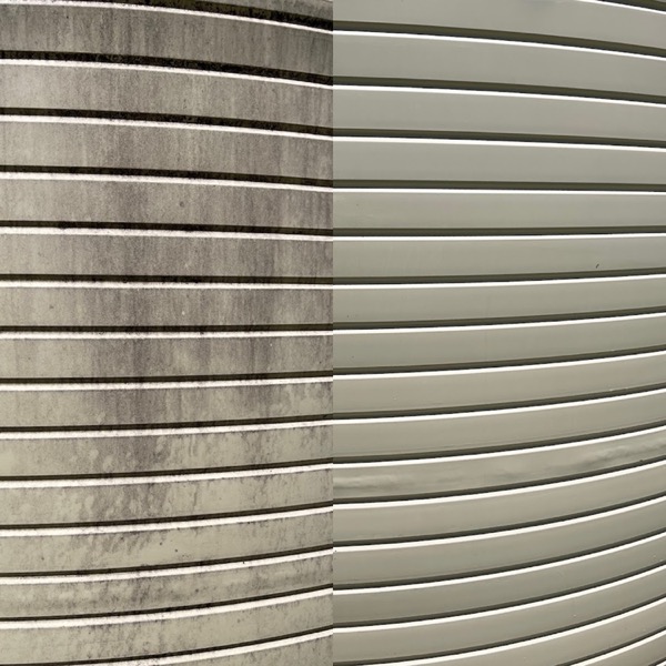 A rendered wall with the left side streaked and the right side plain cream